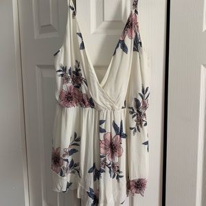 Spaghetti strap low V floral Romper